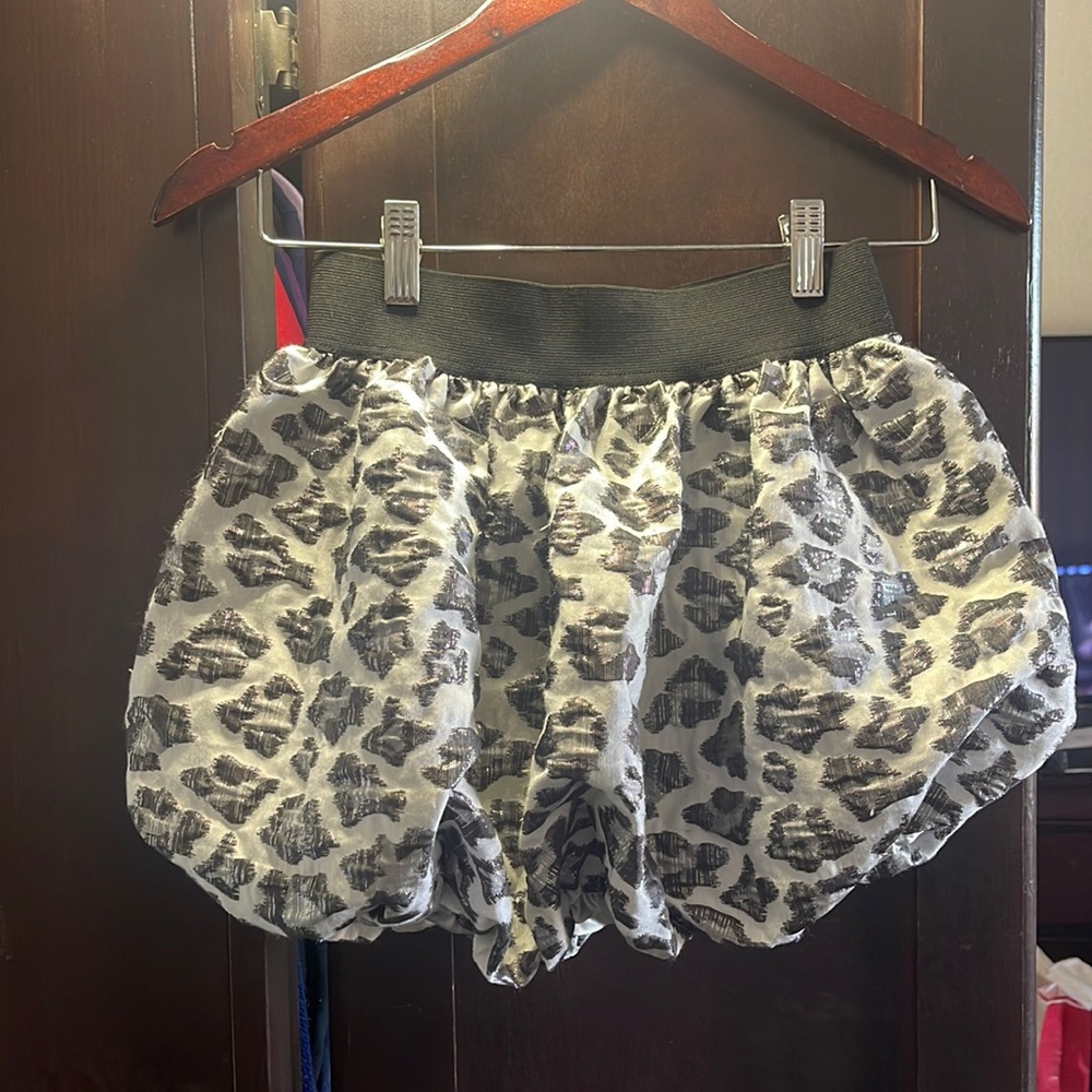Cheetah print, black-and-white  girl skirt, size large.